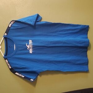 Hollister T shirt with Hollister over shoulder and down sleeve
